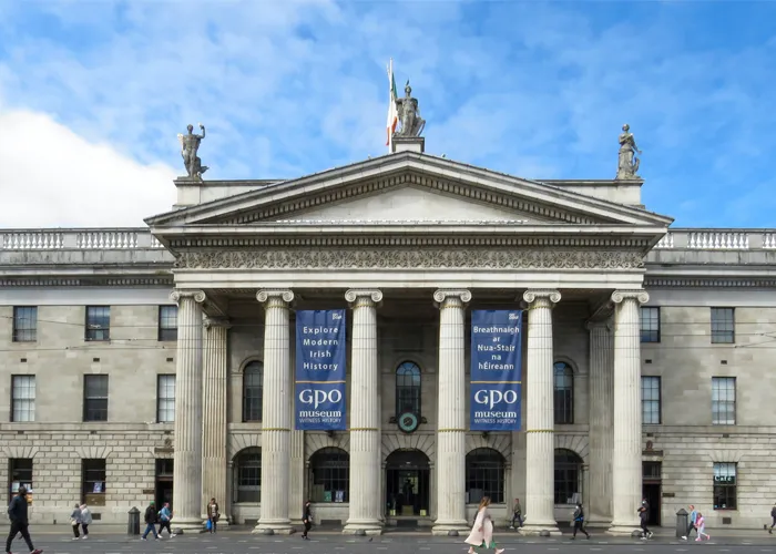 Front view of Dublin’s historic GPO building on O’Connell Street with its grand columns and museum banners.